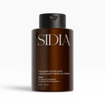 JONES + CO The Body Exfoliant WIRED in amber bottle with black pump top. Tea Leaves & Eucalyptus scent.