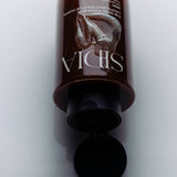 JONES + CO The Body Exfoliant in WIRED fragrance, a brown scrub with rice exfoliators.