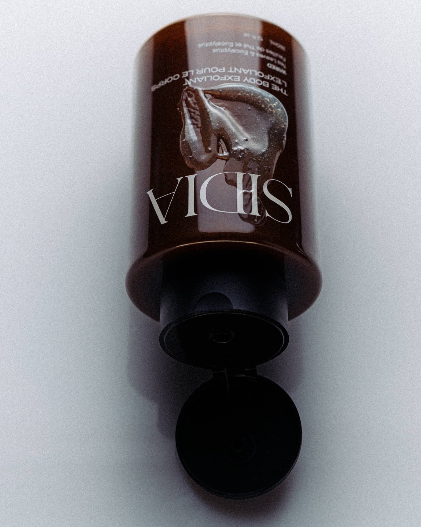 JONES + CO The Body Exfoliant in WIRED fragrance, a brown scrub with rice exfoliators.