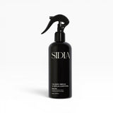 JONES + CO The Body Serum BRALESS in a black spray bottle with a black trigger. Amber & Guaiac Wood scent.
