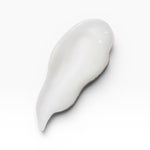 JONES + CO BRALESS The Body Serum, a white, creamy texture swatch with a smooth finish.