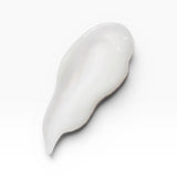 JONES + CO BRALESS The Body Serum, a white, creamy texture swatch with a smooth finish.