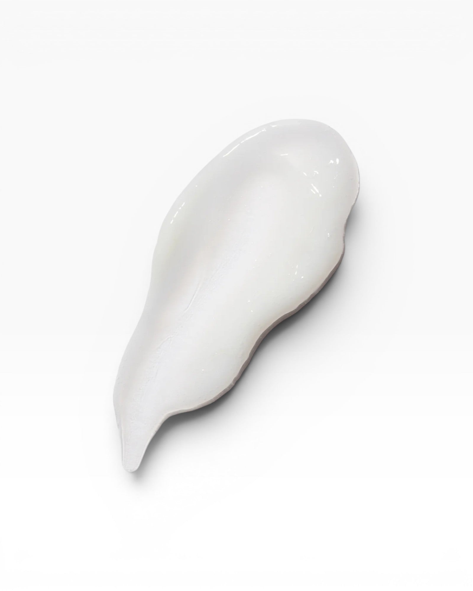 JONES + CO BRALESS The Body Serum, a white, creamy texture swatch with a smooth finish.