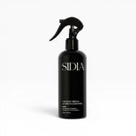 JONES + CO The Body Serum WIRED in black spray bottle with tea leaves and eucalyptus scent. Lightweight, fast-absorbing formula.