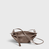 JONES + CO Bon-Bon Cords bag in shiny taupe Italian leather with a pleated design and metal clasp detail.