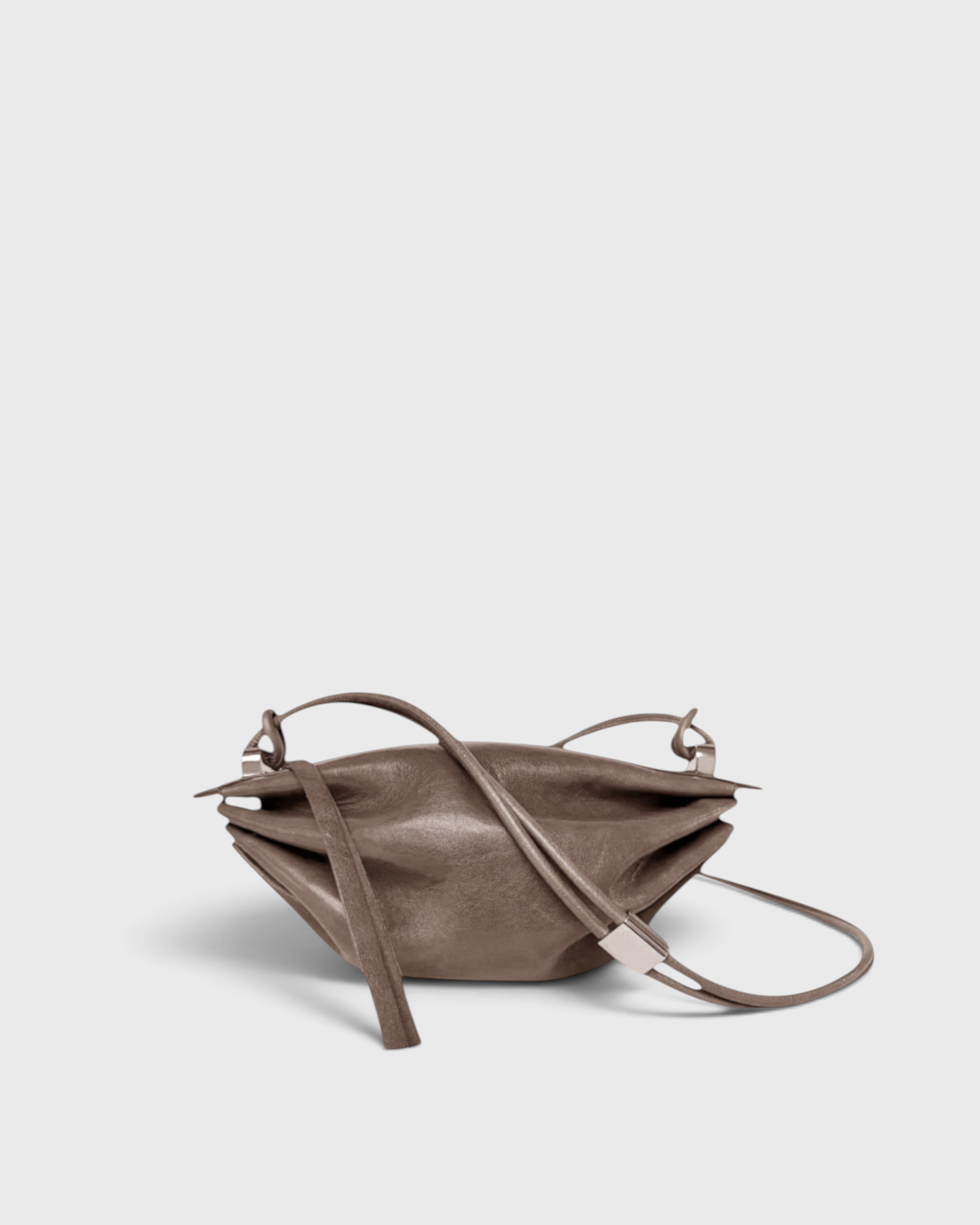 JONES + CO Bon-Bon Cords bag in shiny taupe Italian leather with a pleated design and metal clasp detail.