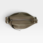 JONES + CO Bon-Bon taupe bovine leather handbag with silver metal clasp and zipper closure, top view.