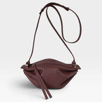 JONES + CO Bon-Bon wine-colored calf leather shoulder bag with pleated ends and palladium-finished brass hardware.