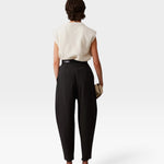 JONES + CO black wool Brady trousers with a high-waisted, tapered, and cropped silhouette, back view.