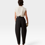 JONES + CO black wool Brady trousers with a high-waisted, tapered, and cropped silhouette, back view.