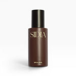 JONES + CO BRALESS body mist in a dark brown bottle with a black cap and gold lettering.