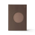 JONES + CO brown lined Open Journal with a circular cutout on the textured hard cover