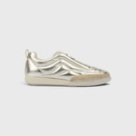 JONES + CO Bubble Ollo sneaker in metallic champagne lambskin leather with a suede toe and translucent foam sole.
