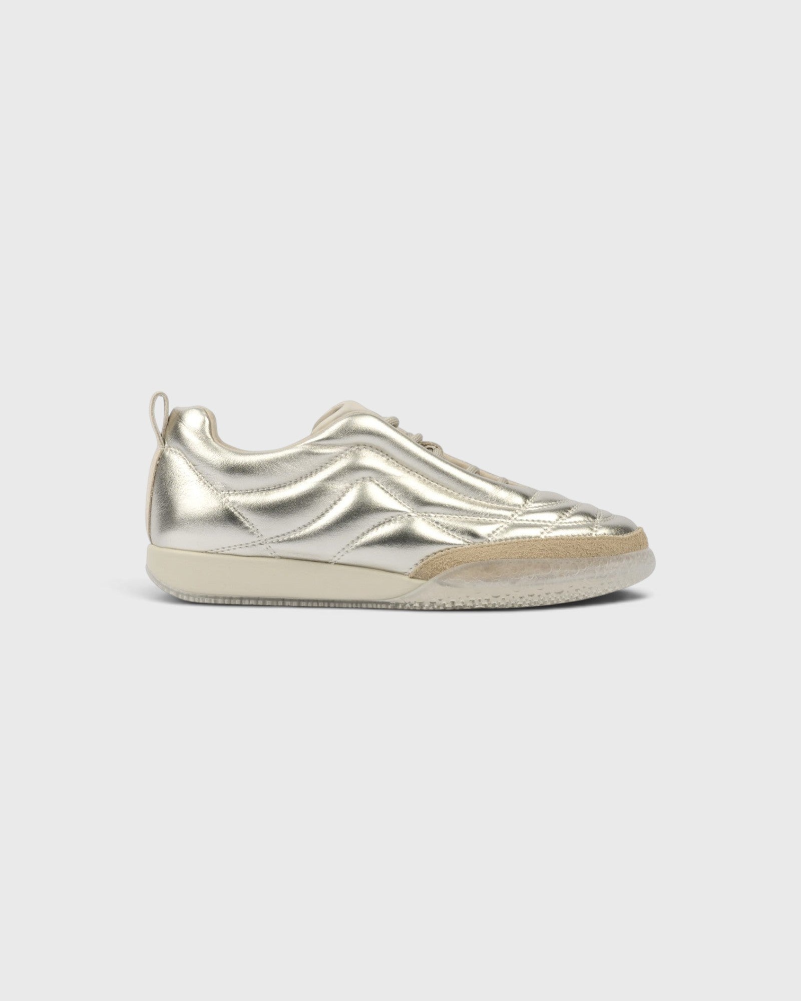 JONES + CO Bubble Ollo sneaker in metallic champagne lambskin leather with a suede toe and translucent foam sole.