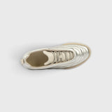 JONES + CO Bubble Ollo sneaker in metallic champagne lambskin leather with a suede toe and translucent bubble sole.