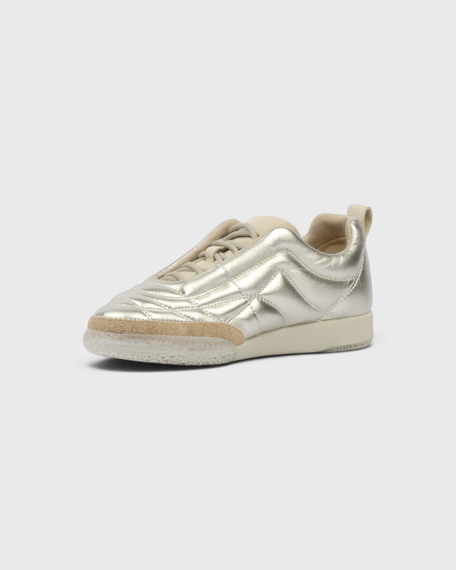 JONES + CO Bubble Ollo sneaker in metallic champagne lambskin leather with a suede toe and translucent bubble sole.
