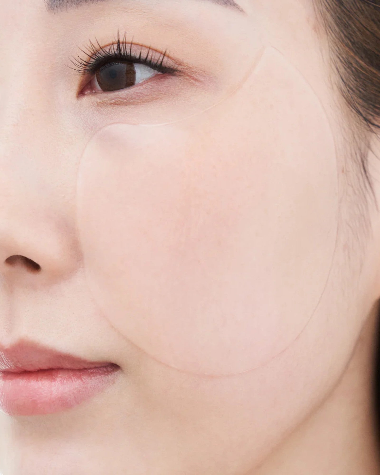 JONES + CO Calm Movements hydrogel eye & cheek mask hydrates, soothes, and boosts skin elasticity. Clear mask design.
