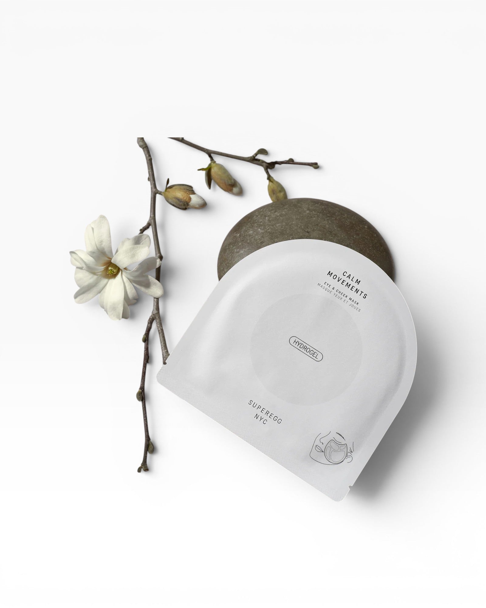 JONES + CO Calm Movements hydrogel eye & cheek mask packaging with a minimalist design, featuring soothing ingredients.