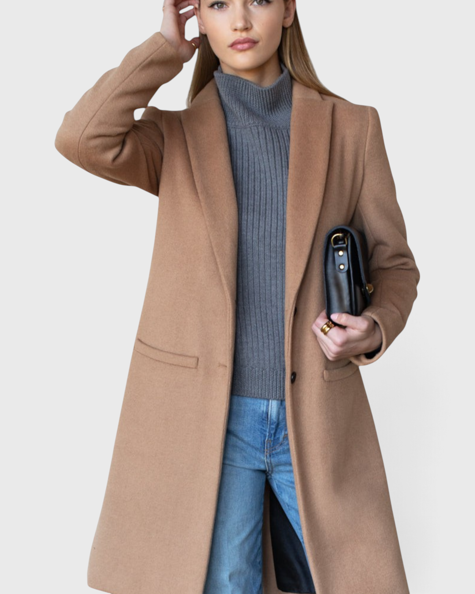 JONES + CO camel wool cashmere tailored coat with notch collar worn by a model with a grey sweater and blue jeans