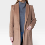 JONES + CO camel wool cashmere tailored coat with notch collar worn by a model over a grey turtleneck and jeans
