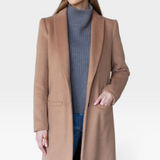 JONES + CO camel wool cashmere tailored coat with notch collar worn by a model over a grey turtleneck and jeans