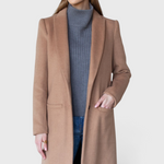 JONES + CO camel wool cashmere tailored coat with notch collar worn by a model over a grey turtleneck and jeans