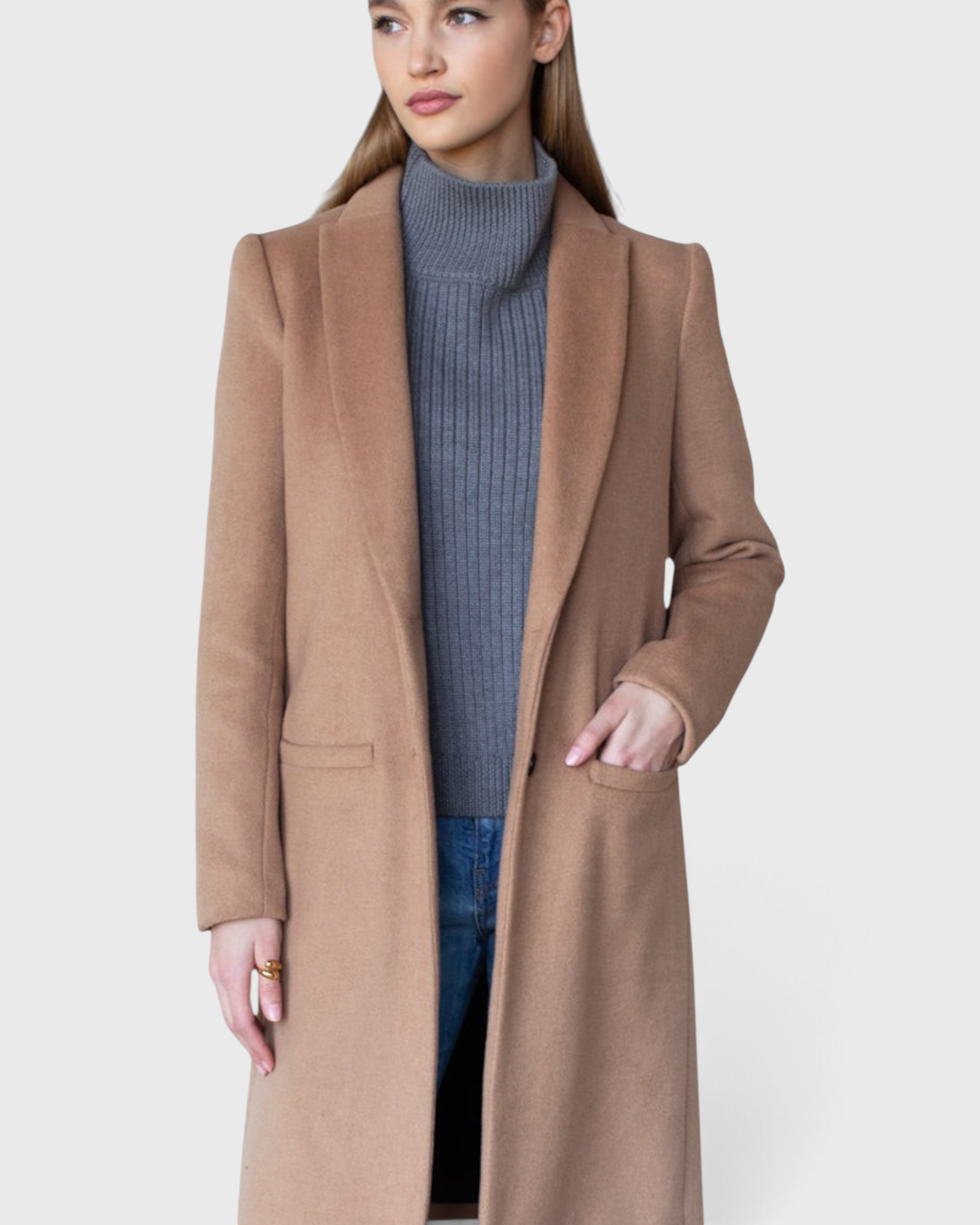 JONES + CO camel wool cashmere tailored coat with notch collar worn by a model over a grey turtleneck and jeans