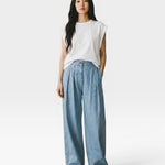 JONES + CO Celeste high-waisted wide-leg pleated cotton trousers with elastic back waistband and side pockets.