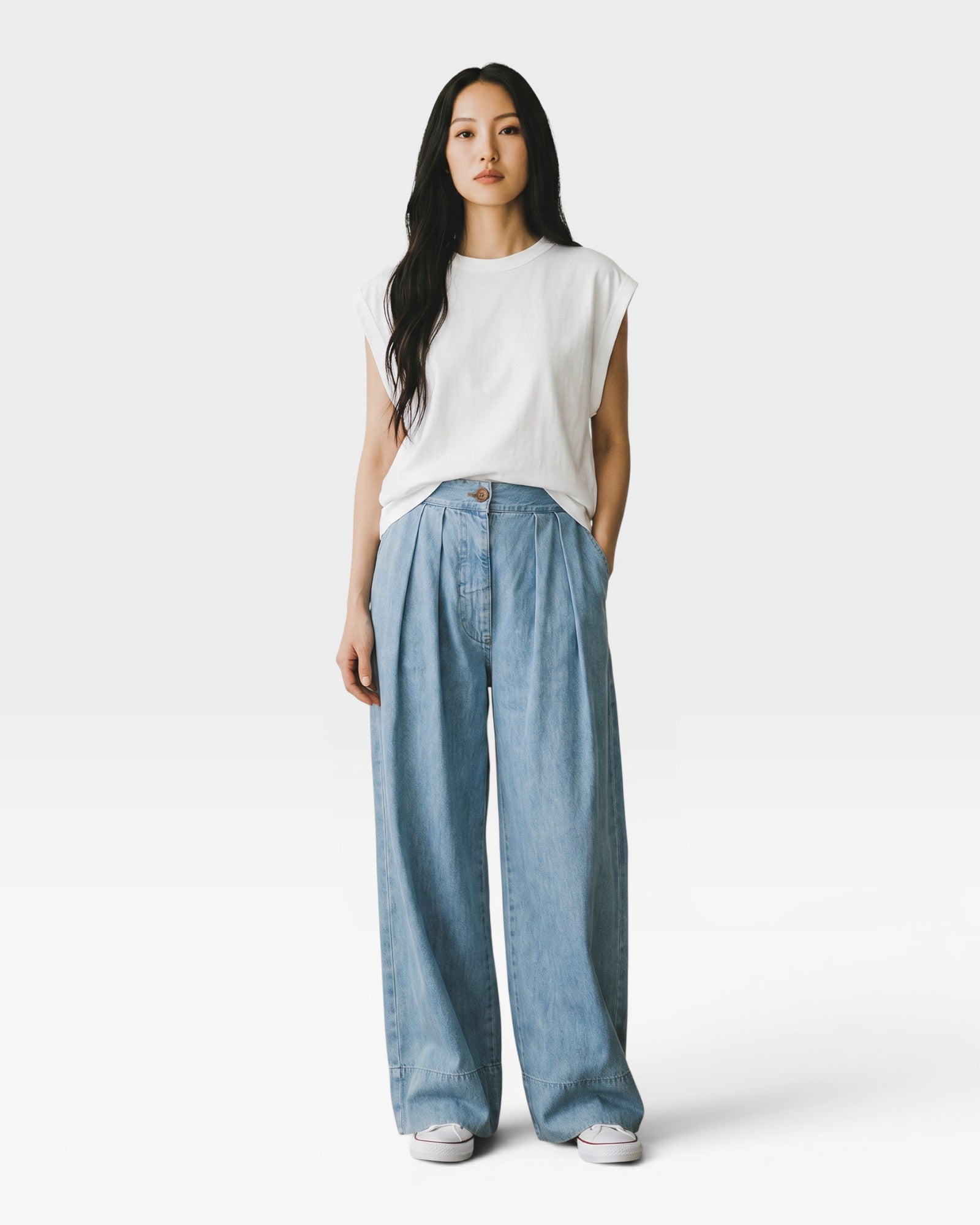 JONES + CO Celeste high-waisted wide-leg pleated cotton trousers with elastic back waistband and side pockets.