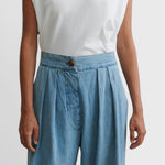JONES + CO Coxsone high-waisted pleated wide-leg trousers in celeste blue organic cotton with a faux button fly.