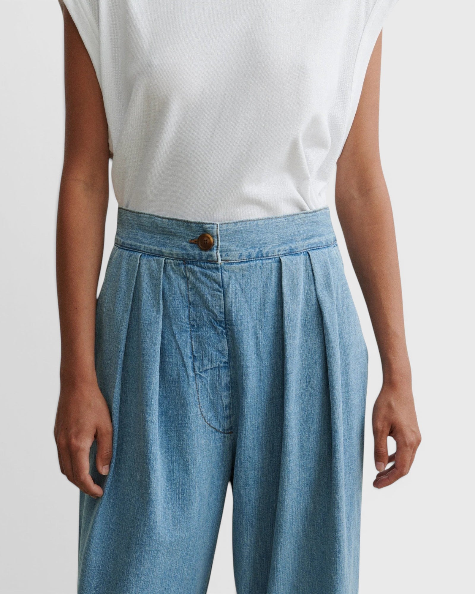 JONES + CO Coxsone high-waisted pleated wide-leg trousers in celeste blue organic cotton with a faux button fly.