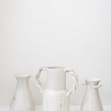 JONES + CO cream speckled ceramic bulb vase with twisted handles, handmade by Bettina Chow.