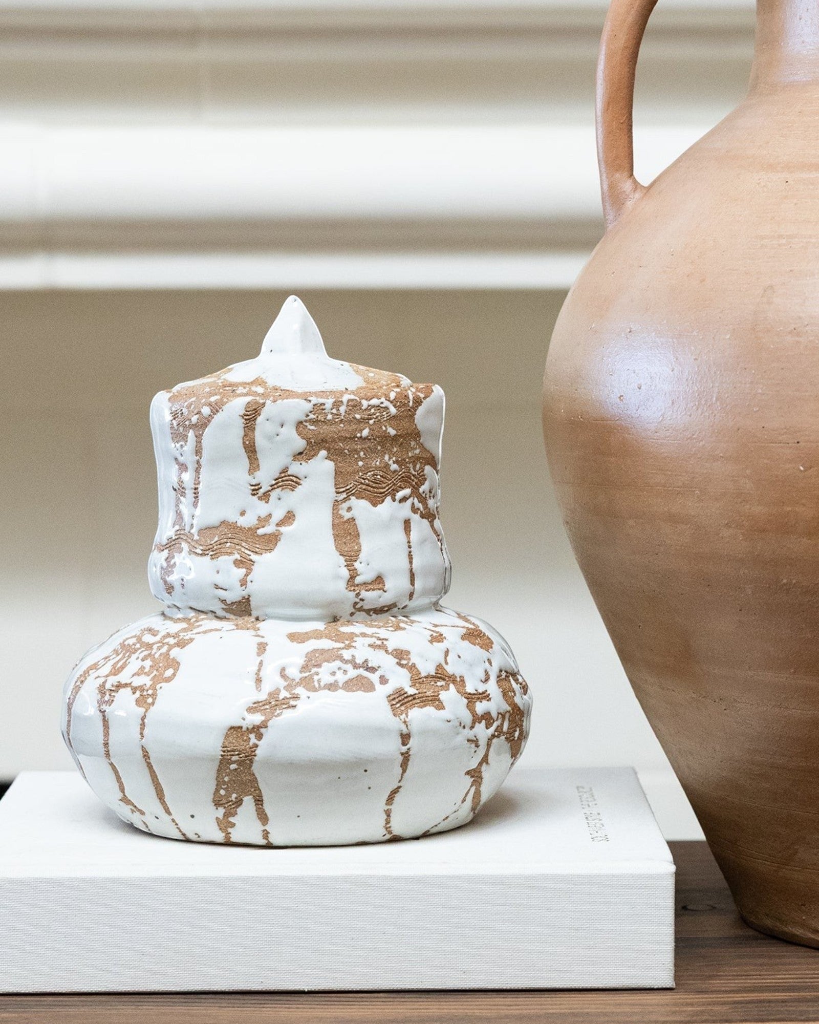 JONES + CO handmade white ceramic vase with lid, featuring organic modern design and expressive glaze.