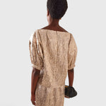 JONES + CO Filly Top in champagne shimmery textured silk with a boat neckline and puff sleeves, rear view.