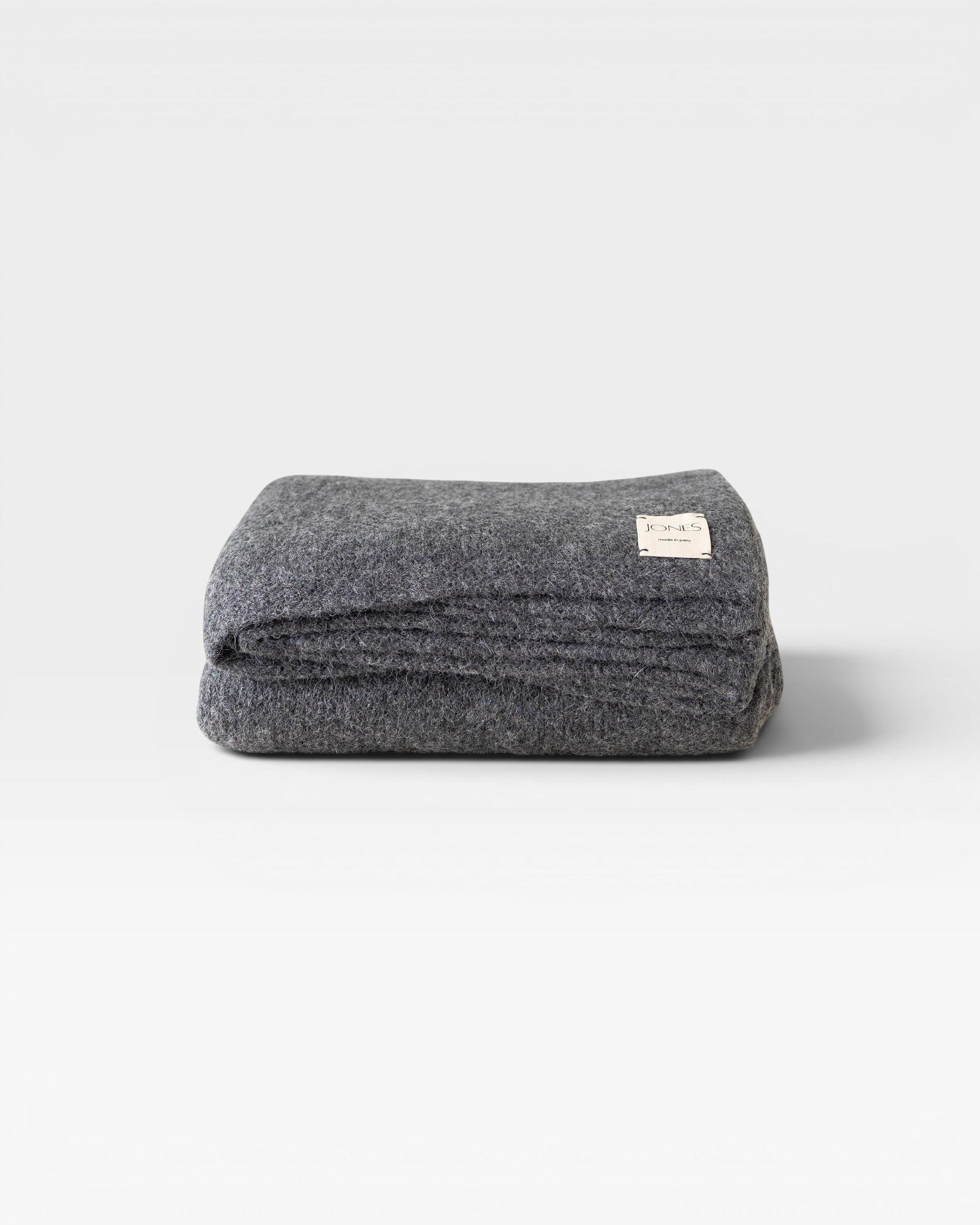 JONES + CO charcoal grey alpaca wool blend throw blanket, medium weight, 62" x 57", woven in Peru.