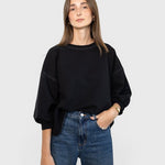 JONES + CO Rachel Comey charcoal crewneck sweatshirt with drop shoulders, cropped sleeves, and raw edge hemline.