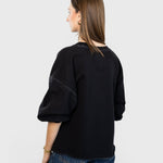 JONES + CO Rachel Comey charcoal Fond sweatshirt with drop shoulders and raw edge hem seen from the back