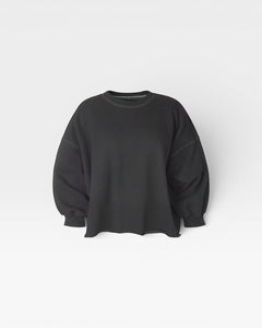 JONES + CO charcoal Fond crewneck sweatshirt with drop shoulders, cropped sleeves, and a raw edge hemline.