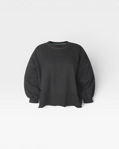 JONES + CO charcoal Fond crewneck sweatshirt with drop shoulders, cropped sleeves, and a raw edge hemline.