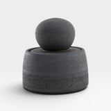JONES + CO matte charcoal stoneware stash jar with a large chunky knob and glossy black interior. Hand-thrown, unique piece.