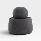 JONES + CO matte charcoal stoneware stash jar with a large chunky knob. Hand-thrown, textured exterior, glossy interior.