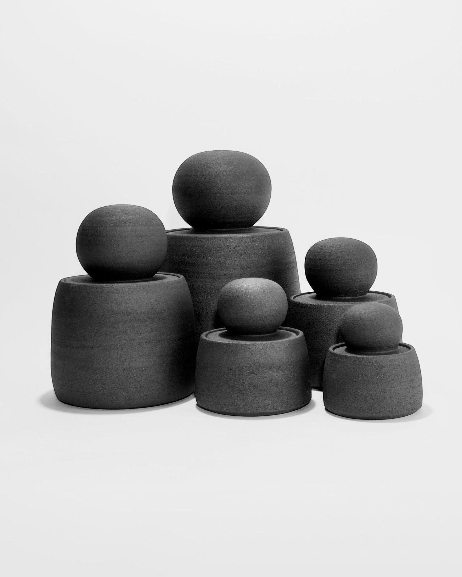 JONES + CO matte charcoal stoneware stash jars with chunky knobs. Hand-thrown, unique, and perfect for organization.