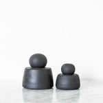 JONES + CO matte charcoal stoneware stash jars with chunky knobs, perfect for organization.