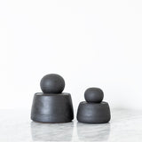 JONES + CO matte charcoal stoneware stash jars with chunky knobs, perfect for organization.