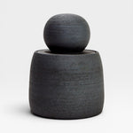 JONES + CO matte charcoal stoneware stash jar with a chunky knob lid. Handmade, textured exterior and glossy interior.