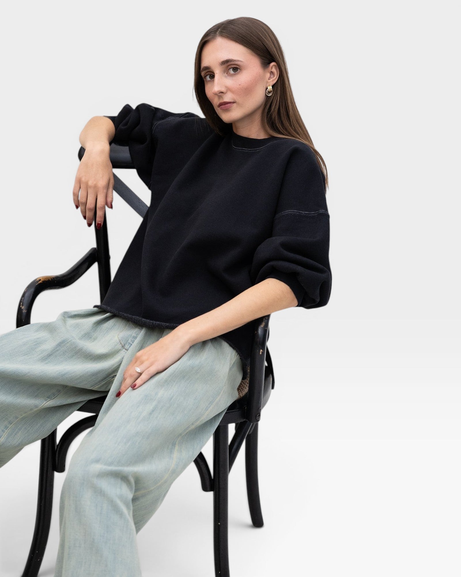 JONES + CO charcoal grey crewneck sweatshirt with drop shoulders, raw hem, and distressed details.