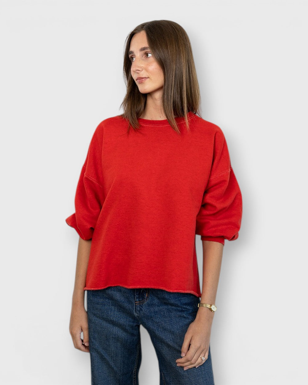 JONES + CO Rachel Comey cherry red crewneck sweatshirt with drop shoulders and raw edge hem worn by a model