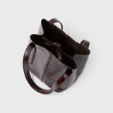 JONES + CO Bucket Tool bag in chestnut lustre leather with vertical paneling, sturdy handles, and internal tie closure.