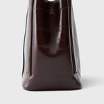 JONES + CO Bucket Tool bag in chestnut lustre leather with vertical paneling and sturdy elongated handles.