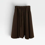 JONES + CO chocolate brown Angie skirt featuring an elastic drawstring waistband and a flowy midi silhouette.